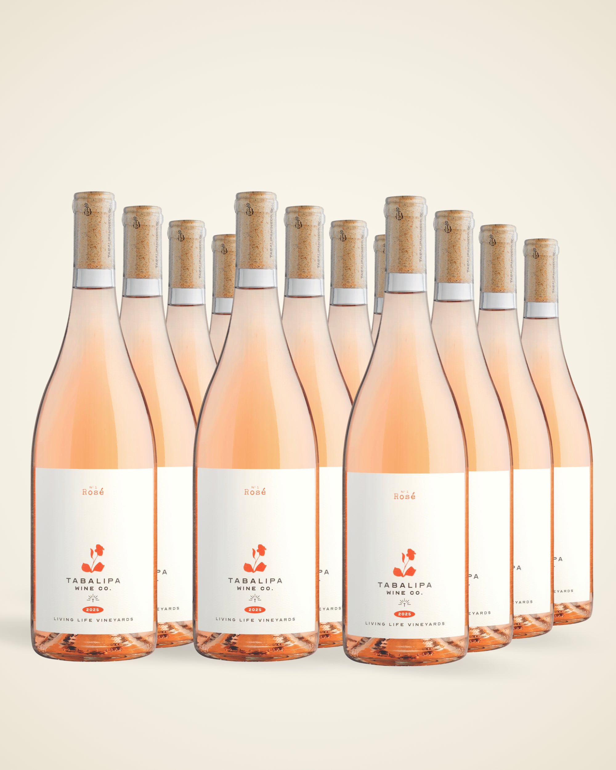 A group of 12 rosé bottles on tan gradient background.