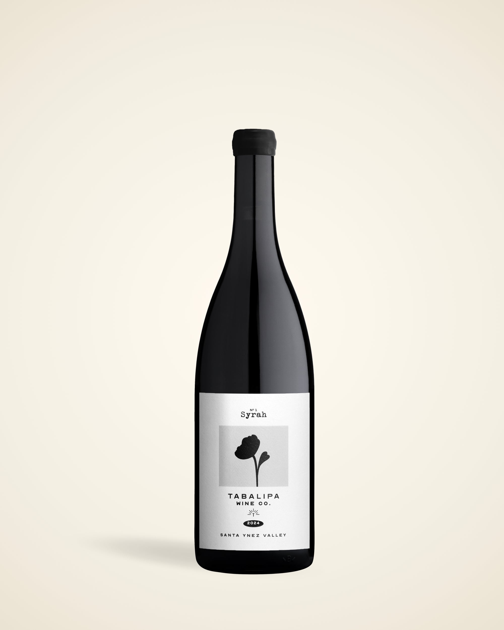 Tabalipa Wine Co Estate Syrah bottle on a subtle gradient tan background